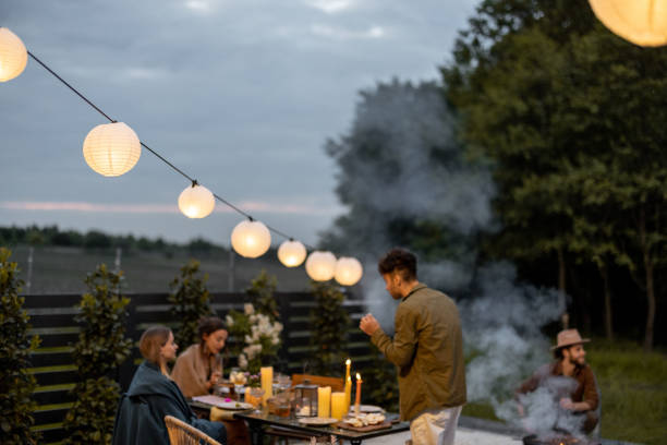istock Friends dining at the backyard in the evening 1323613602