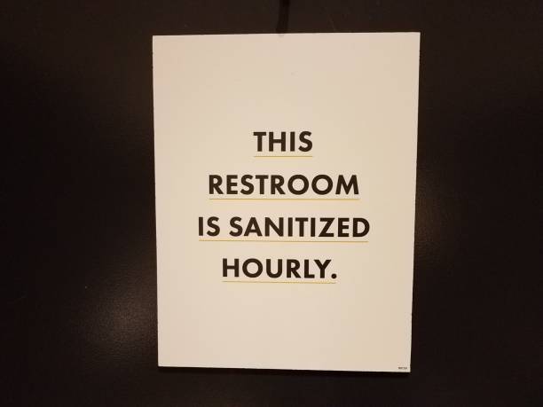 istock restroom is santized hourly sign on bathroom door 1323614343