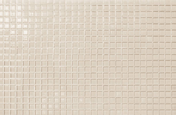 istock Cream pastel ceramic wall and floor tiles abstract background. Design geometric mosaic texture decoration of the bedroom. Simple seamless pattern for backdrop advertising banner poster or web. 1323615926