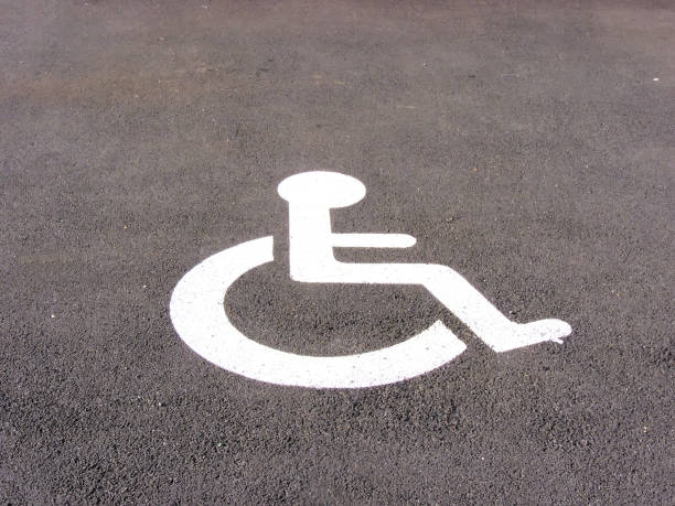 istock the symbol handicapped on a parking space 1323616040