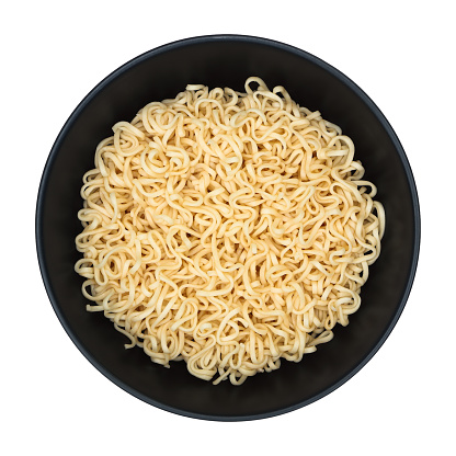 instant noodles on circle black bowl isolated on white.