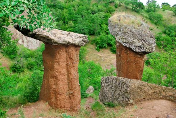two old stones in a hill slope