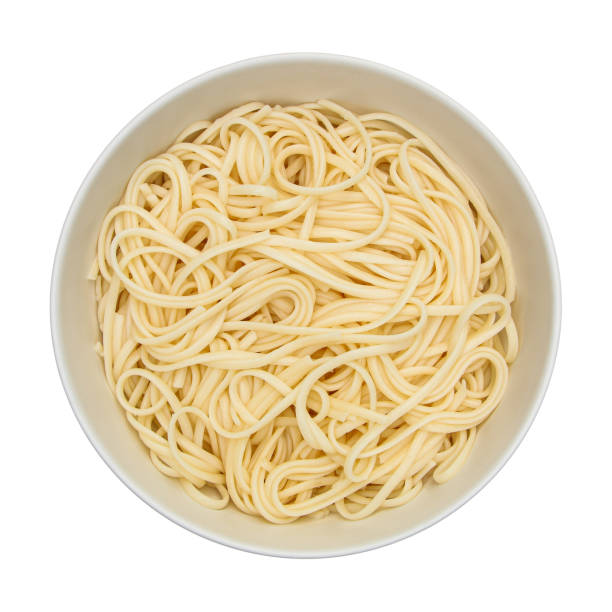 istock linguine pasta on circle white bowl isolated on white 1323618945