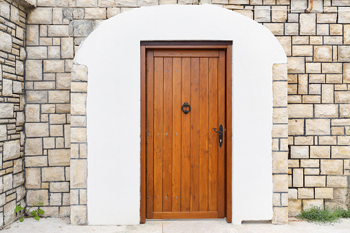 Paris, an old wooden door, typical building in the Marais