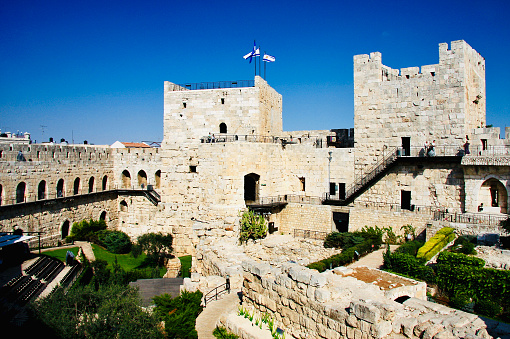 Horizontal landscape photo of the ancient Citadel known as the Tower of David, near the Jaffa gate entrance to the Old City, Jerusalem