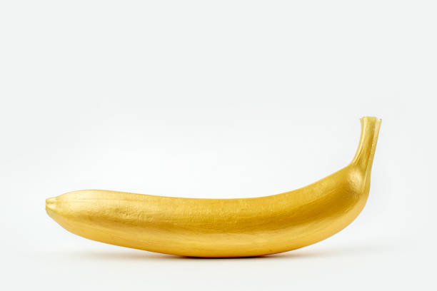 istock Banana coloured by golden paint 1323620425