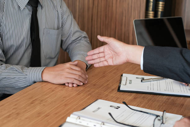 istock Examiner reading a resume during job interview at office Business and human resources concept 1323624408