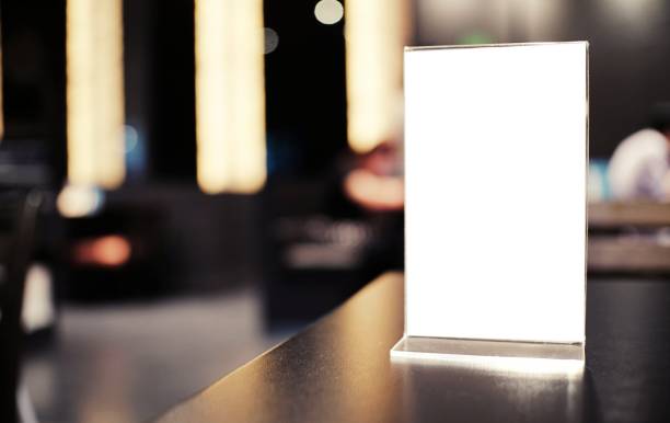 istock Menu frame standing on wood table in Bar restaurant cafe. space for text marketing promotion. 1323624844