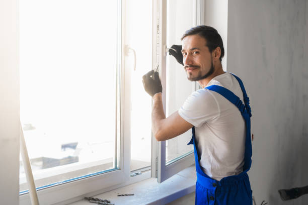 istock Man installs the window and looks at the camera 1323624859