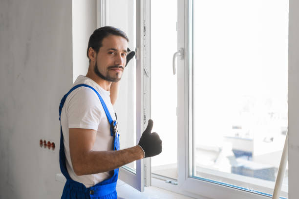 istock Male worker installs a window and showing thumb 1323625373