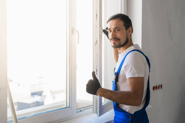 istock Man installs a window and showing thumb 1323625379