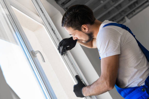 istock The foreman installs a window frame in the room 1323625389
