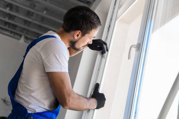 istock The foreman installs a window frame in the room 1323625397