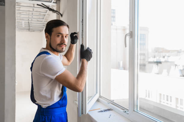 istock The worker stands at the open window 1323625505