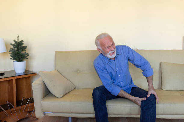 istock An Older Man with Chronic Knee Problems and Pain. 1323625666