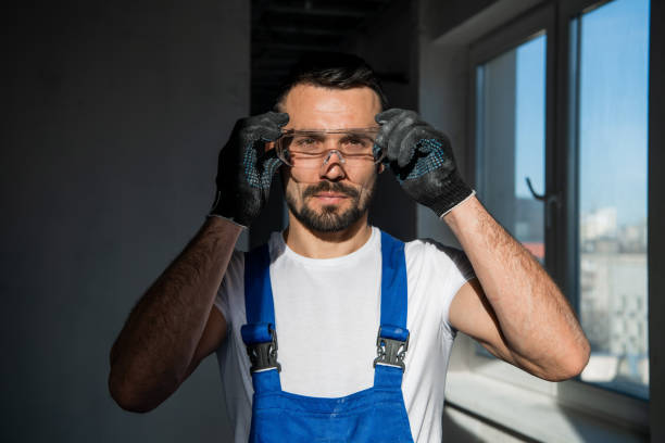 istock The man in gloves and goggles smiles kindly 1323625742