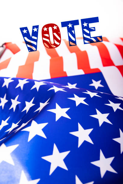 istock Vote text with american flag on background 1323625896