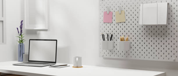 istock Minimal workspace with laptop, stationery and decoration in home office room, 3D rendering 1323625926