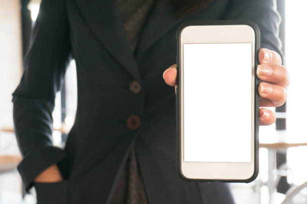 istock Women's hands holding cell telephone blank copy space screen. smart phone with technology concept. 1323626129