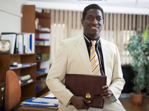 istock Successful african american businessman with briefcase in office 1323626893