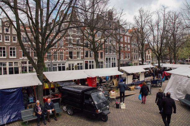 Amsterdam, Netherlands - 04 16 2016: The Noordermarkt is a square in the Jordaan neighborhood of Amsterdam in the Netherlands. Markets are held on the square every Monday. The square is lined by cafés and restaurants.