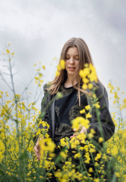 istock Young girl on yellow rapeseed field 1323630636
