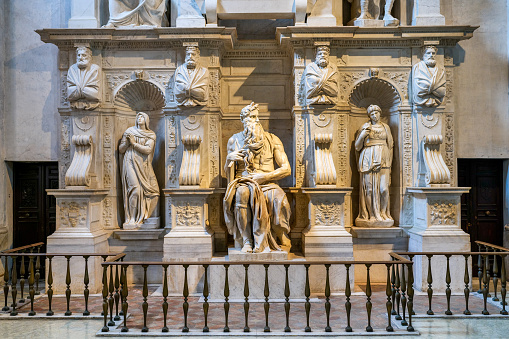 Rome, Italy, June 11 -- The stunning Tomb of Pope Julius II with the statue of Moses by Michelangelo Buonarroti, inside the church of San Pietro in Vincoli (Saint Peter in Chains), in the Rione Monti (Monti district) in the heart of the historic center of Rome. Built since 442 AD. on some previous Roman remains, this church is one of the oldest in Rome, famous for its artistic treasures and for hosting the chains of St. Peter. The Monti district is a popular and multi-ethnic quarter much loved by the younger generations and tourists for the presence of trendy pubs, shops and restaurants, where you can find the true soul of the Eternal City. The quarter, located between the Esquiline Hill and the Roman Forum, is also rich in numerous churches and archaeological remains from the Roman era. Image in high definition format.