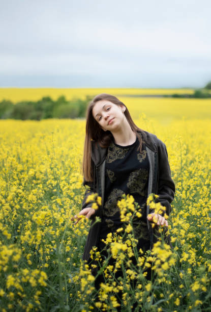 istock Young girl on yellow rapeseed field 1323630638