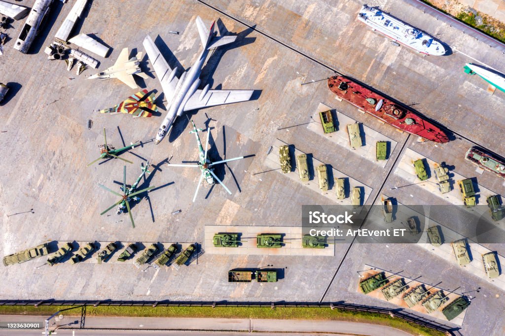 Top view of the military base. Tanks, self-propelled howitzers, rocket launchers, helicopters and aircraft Military Base Stock Photo