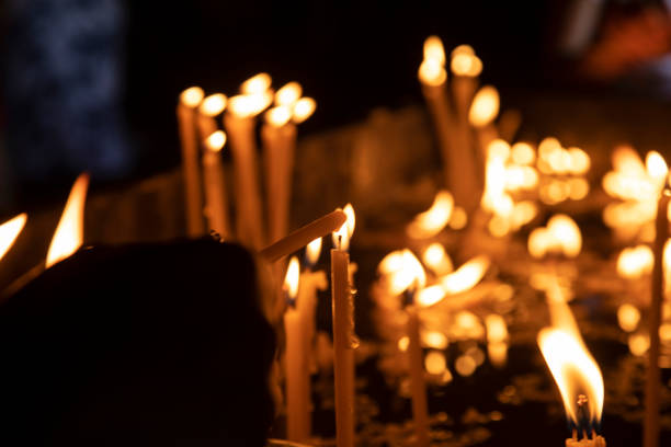 istock light candles in the church 1323633373