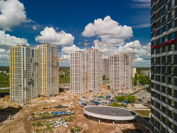 Photo of Construction site of the new high-rise buildings. Aerial photo of the construction site. Investments in real estate business