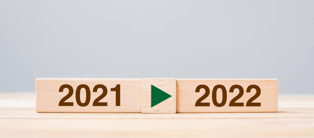 istock 2021 and 2022 wooden block on table background. Resolution, strategy, countdown, goal, change and New Year holiday concepts 1323636584