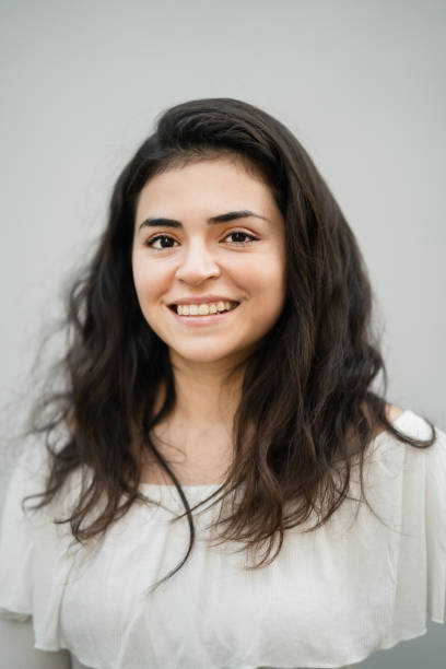 istock Happy woman studio portrait. 1323636706