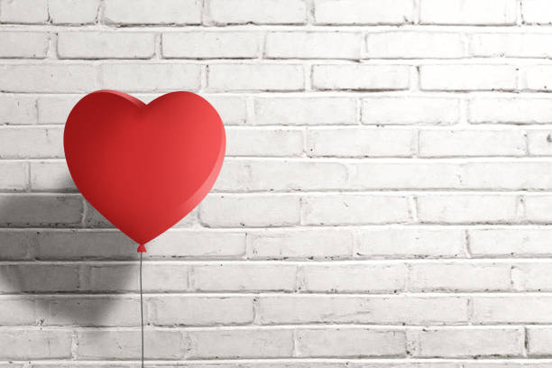 istock Heart balloon with brick wall background 1323639100