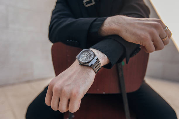 istock Modern gentleman sitting on chair 1323639633