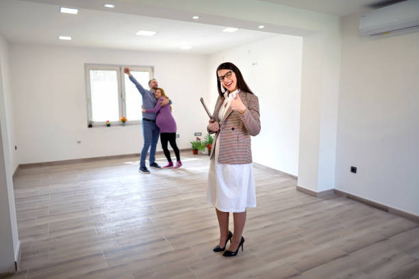 istock Real estate agent smiling to the camera 1323643489