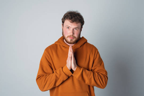 Please help me. Redhead bearded handsome man begging for favour with sad face, need something, frowning and pleading
