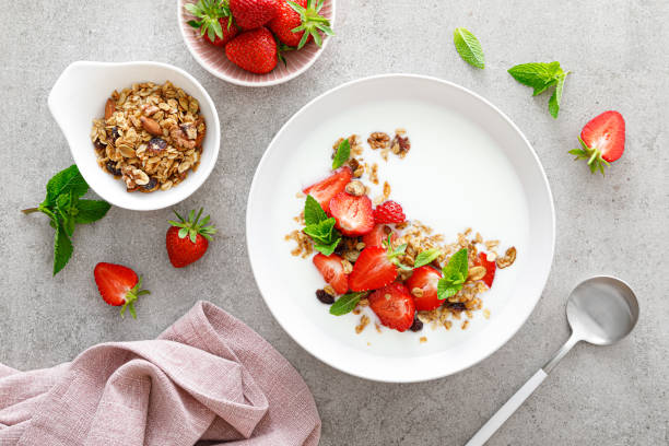 istock Strawberry granola with greek yogurt, nuts and fresh berries for breakfast, top view 1323645913