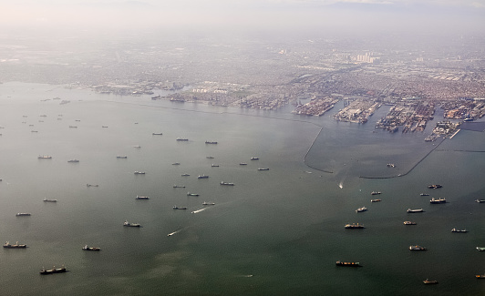 Tanjung Priok Port, Jakarta, Indonesia, seen from above. Photographed from a commercial plane, this port is the busiest port in Indonesia
