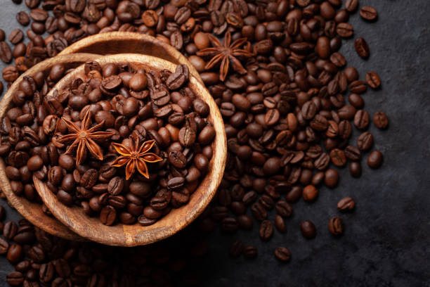 istock Roasted coffee beans in wooden bowl 1323648765