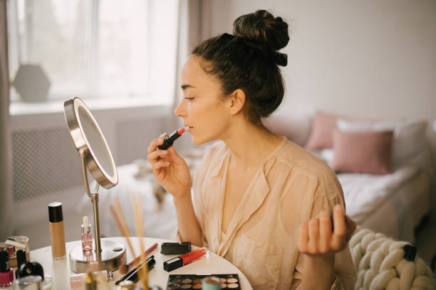 istock Young woman applying makeup. Beauty routine. 1323648779