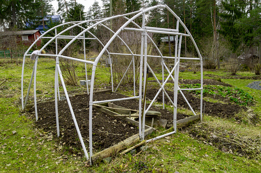 greenhouse frame on a garden plot. High quality photo