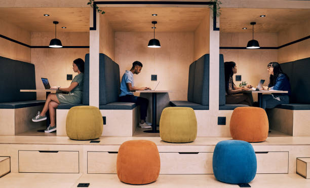 shot of creatives working in cubicles - modern office stockfoto's en -beelden