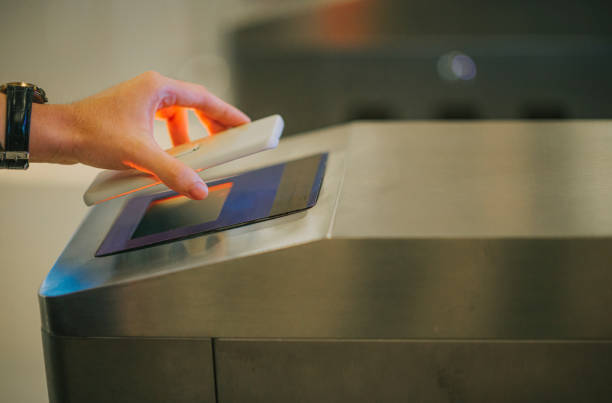 istock waiting in line e-ticketing asian chinese man hand using smart phone mobile app barcode scanning at movie theater entrance 1323650268