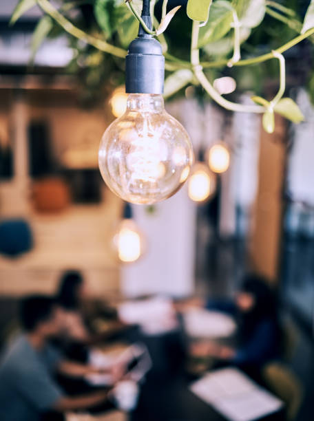 istock Shot of a lightbulb hanging in a cafe 1323651756
