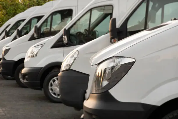 Commercial delivery vans are waiting for the next order