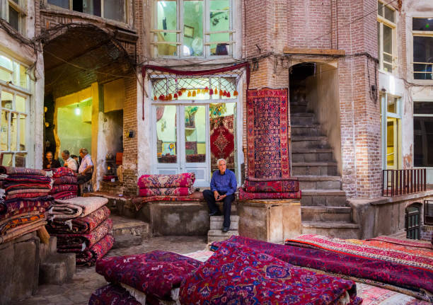 the carpet (rug) bazaar of tabriz, east azerbaijan province of iran. - nouri stockfoto's en -beelden