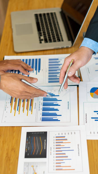 istock Business group meetings Talk about graph analysis with calculators and laptops with tablets on the office table. 1323652527