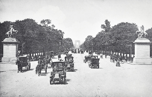 The horse-drawn carriages still had the majority, however first automobiles appeared. Photography from 19th century.