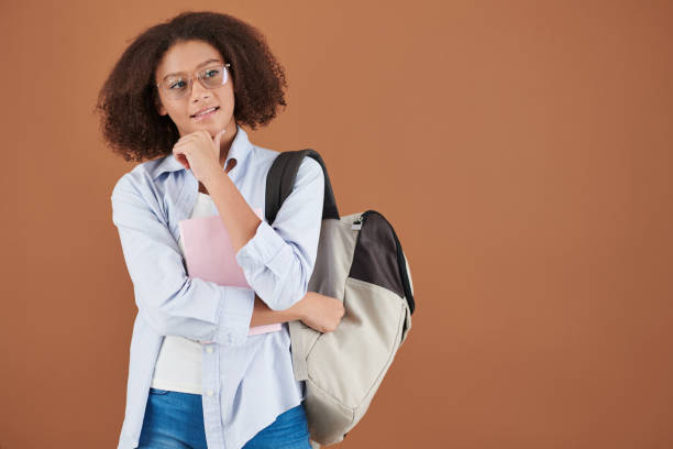 istock Pensive High School Girl in Glasses 1323655412